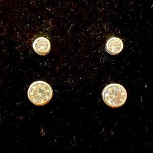 Two pairs of crystal studs.